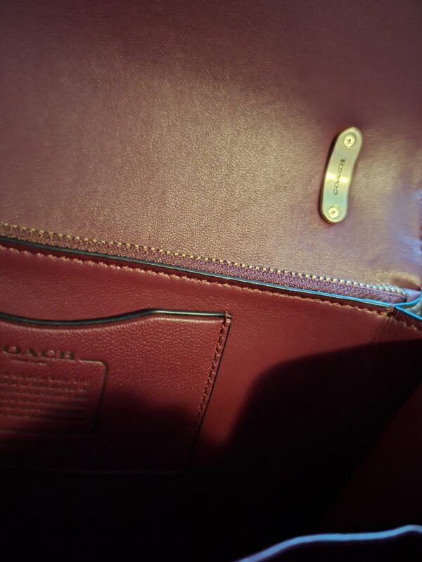 20260219_093652 Coach signature canvas schoudertas