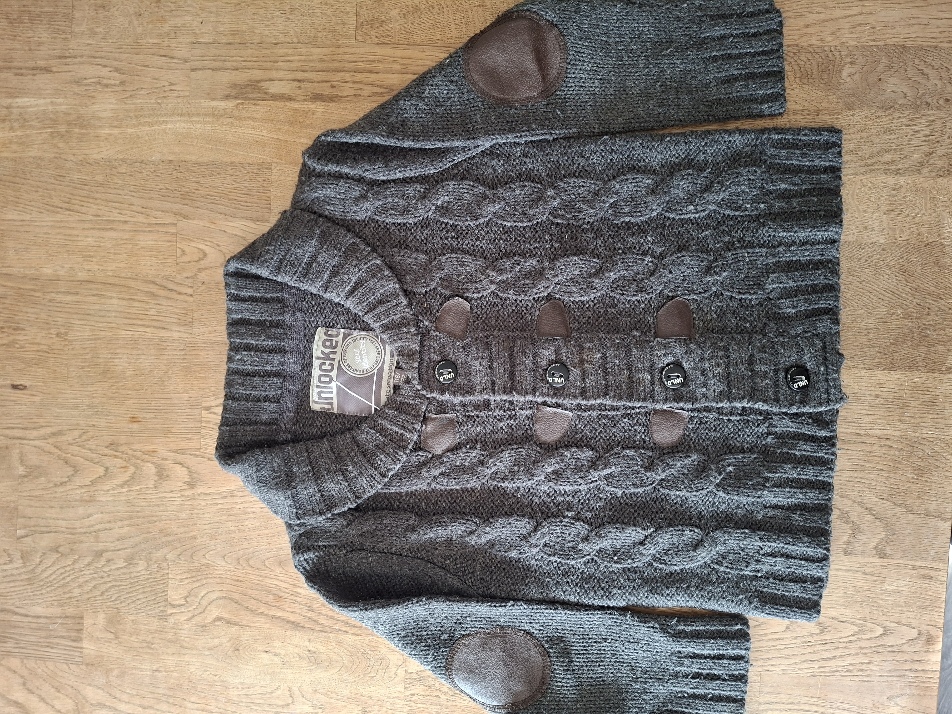 Unlocked gebreide vest grijs kabelsteek elleboogpatches