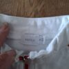 20260329_162001 Mexx vest wit met rode strepen en rits