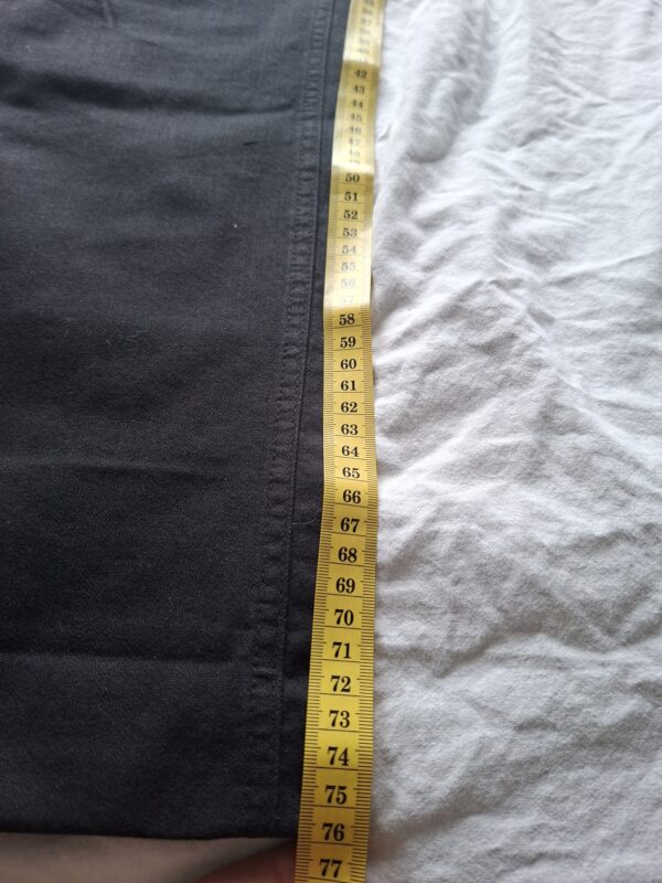 Zwarte flared broek met strass details en witte stiksels