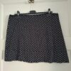 Zwart rokje met witte stippen