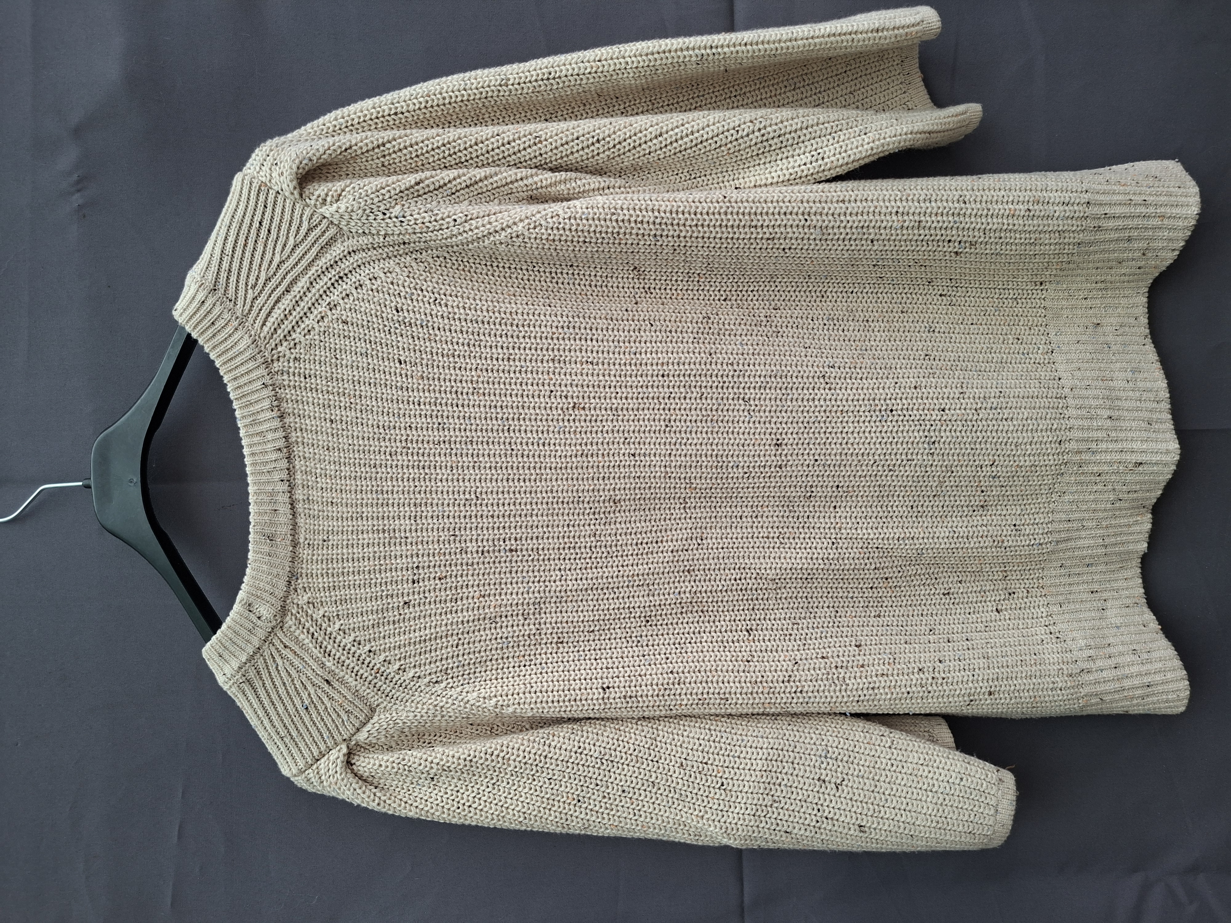 Grofgebreide trui crème gemeleerd met ajourdetail