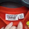 Looney Tunes sweater oranje met karaktersprint