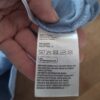 20260418_161406 H&M sweater lichtblauw dinosaurus pailletten maat 110/116 nette staat