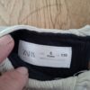 20260505_181513 Zara zwarte ribtop met ecru kraag maat 110