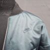 20260517_180222 Nike Sportswear reversible windrunner jack zwart/teal maat S