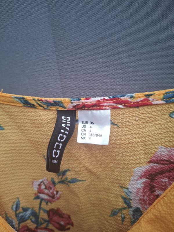 H&M Divided top geel met rozenprint en volant maat 36
