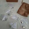 20260610_163811 Gnoce Jewelry sieraden set 6 bedels en ketting, zilverkleurig